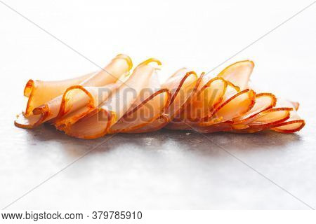 Dried spanish ham. Lomo embuchado on kitchen table.