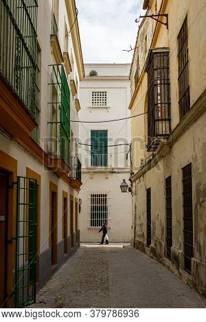 Jerez De La Frontera, Cadiz / Spain - April 4 2015: Woman Walking With Plastic Bags In Old Colonial 