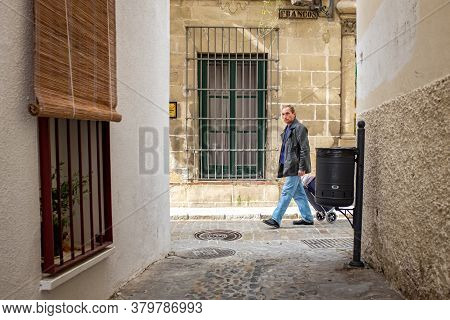 Jerez De La Frontera, Cadiz / Spain - April 4 2015: Man Walking In Old Colonial Street Looking At Th