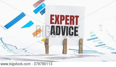 Expert Advice Text On Paper Sheet With Chart, Dice, Spectacles, Pen, Laptop And Blue And Yellow Push