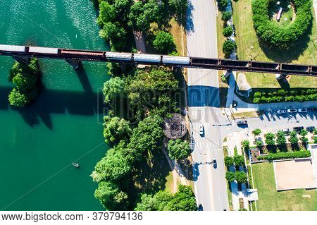 Straight Down Above Street And Intersection And Railroad Bridge Crossing The Colorado River Or Town 
