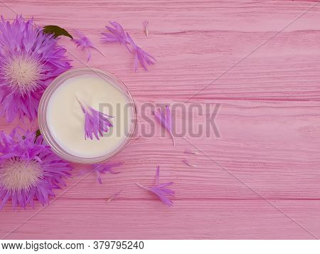 Cream Cosmetic Flower On Wooden Background Mask