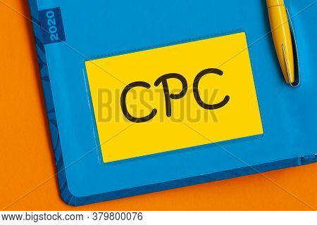 The Word Cpc Is Written In Black Marker On The Yellow Paper For Notes. Cpc - Cost Per Click