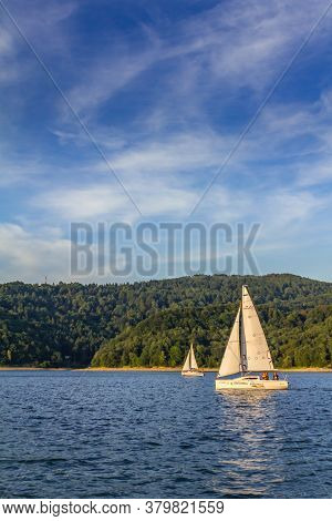 Poland. Podkarpackie Voivodeship. Bieszczady, Zalew Solinski, Solina 01/08/2015 - Two Sailboats On T