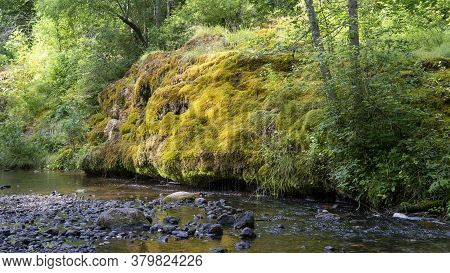 Waterfall At City Rauna, Latvia. River With A Rocky Bottom And Rauna Staburags Cliff. A Unique Rock 