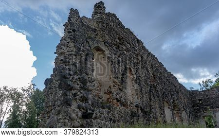 Medieval Castle Ruins In Latvia Rauna. Old Stoune Brick Wall Of Raunas Castle Where Was Living Archb