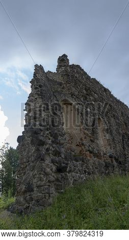 Medieval Castle Ruins In Latvia Rauna. Old Stoune Brick Wall Of Raunas Castle Where Was Living Archb