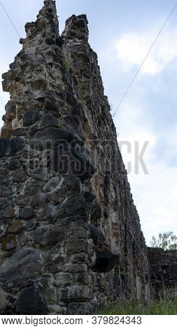 Medieval Castle Ruins In Latvia Rauna. Old Stoune Brick Wall Of Raunas Castle Where Was Living Archb