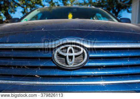 Miercurea Ciuc, Romania- 07 August 2020: Dirty Toyota Logo , Visible Wunder Baum Air Freshener On Pa
