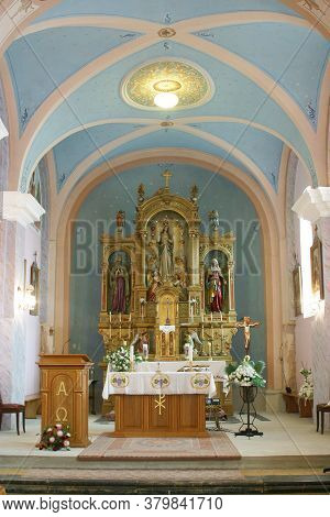PESCENICA, CROATIA - SEPTEMBER 07, 2013: High altar in the parish church of the Assumption of the Virgin Mary in Pescenica, Croatia