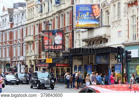 London, Uk - July 9, 2016: People Walk By Lyric Theatre And Apollo Theatre In West End, London, Uk. 