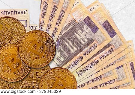 20 Belorussian Rubles Bills And Golden Bitcoins. Cryptocurrency Investment Concept. Crypto Mining Or
