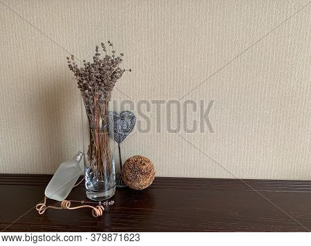 A Glass Vase With Lavender, A Heart And A Decorative Ball Highlight The Frosted Bottle Of Perfume. F