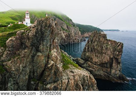 Lighthouse, Huge Rocks On The Ocean, Sea Summer Landscape, Old Stone Building On A High Cliff, Gamov