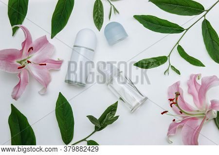 Roller Deodorants In A Transparent Glass Bottle With An Open And Closed Lid With Green Leaves And Pi