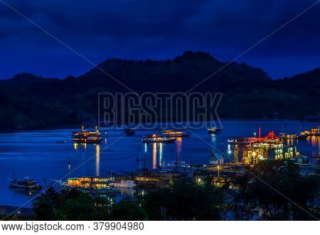 A View Over The Harbour At Labuan Bajo And Nearby Island At Night, Flores, Indonesia