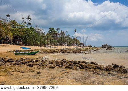 A Boat On Melina Beach On Tiomen Island At Low Tide, Malaysia