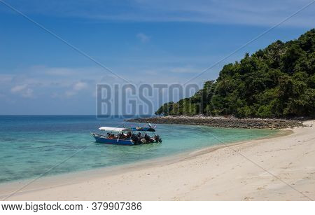 Tourist Boats Moored On A Beach On The Tropical Island Of Pulau Tulai, Near Tiomen Island, Malaysia