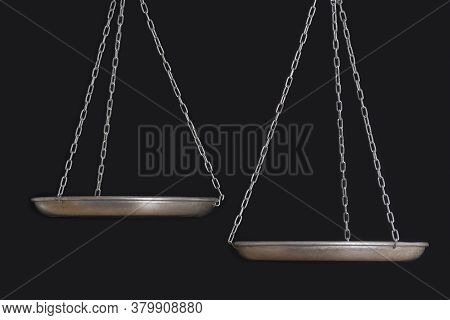 Empty Balance Scales On Black Background Close Up. Front View. Copy Space
