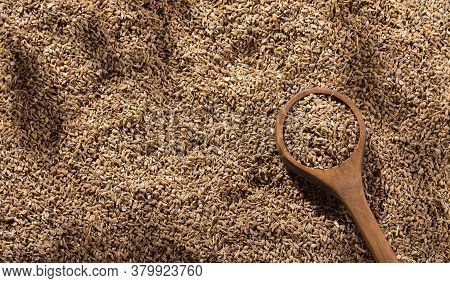 Dried Anise Seeds In Wooden Spoon - Pimpinella Anisum