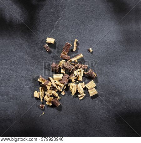 Close Up Of Ayurvedic Herb Liquorice Root,licorice Root, Mulethi Or Glycyrrhiza Glabra Root On A Woo