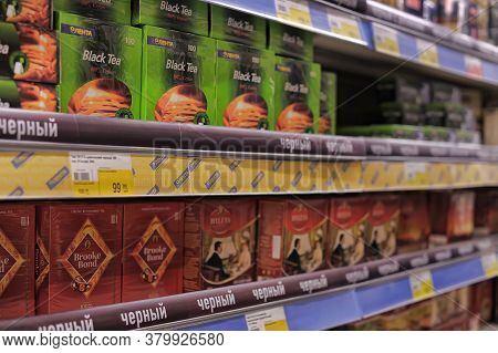 Russia, St. Petersburg, 08,03,2014 Packages With Tea And Cofen Shelves In The Supermarket