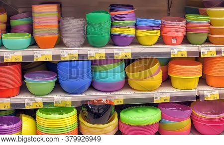 Russia, St. Petersburg, 11,01,2014 Plastic Bowls And Other Plastic Dishes On The Supermarket Shelf