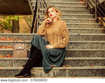 Lost In Thoughts. Casual Style Student. Fall Season. Girl In Corrugated Skirt And Sweater. Pleated T