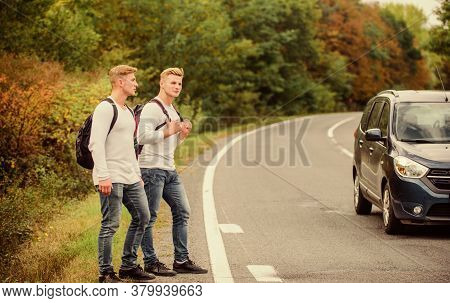 Hitchhiking Gesture. Begin Great Adventure In Your Life With Hitchhiking. Company Friends Travelers 