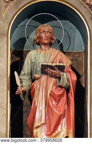 SVETI PETAR OREHOVEC, CROATIA - JUNE 26, 2013: St. John the Evangelist statue on the main altar at St. Peter's Church in Sveti Petar Orehovec, Croatia
