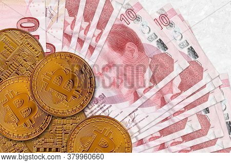 10 Turkish Liras Bills And Golden Bitcoins. Cryptocurrency Investment Concept. Crypto Mining Or Trad
