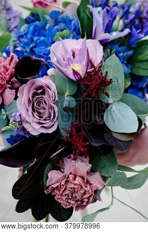 Close-up Bouquet Of Of Flowers On A Light Background. Bouquet Of Eucalyptus, Carnation, Hydrangea, R