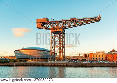 GLASGOW, UK - FEB 26, 2020: The Finnieston Crane or Stobcross Crane stand at waterfront of city center in Scotland, United Kingdom as the symbol of engineering heritage
