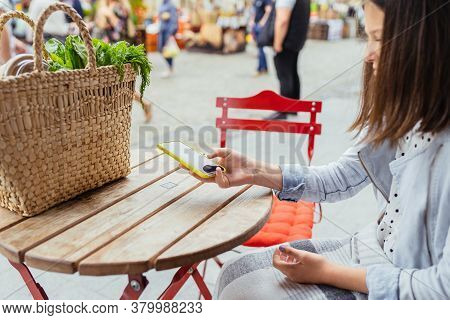 Pretty Teenager Girl Using The Phone To Scan The Qr Code To Select Food Menu At Outdoor Cafe In The 