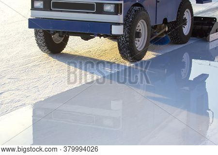 Special Machine For Cleaning Ice On An Ice Rink At Work. Transport Industry
