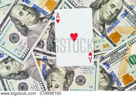 Playing Cards On Us Dollars Background. Close Up Of A Lot Of Banknotes Hundred Dollar Bills. America