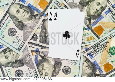 Playing Cards On Us Dollars Background. Close Up Of A Lot Of Banknotes Hundred Dollar Bills. America