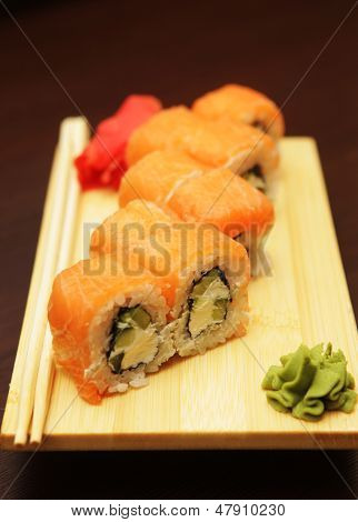 Japanese Sushi Served On Wooden Board