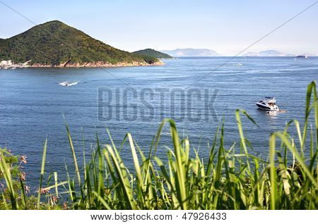 Boats on the blue sea off Hong Kong Island