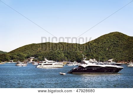 Luxury Boats Anchored In A Bay Off Hong Kong Island