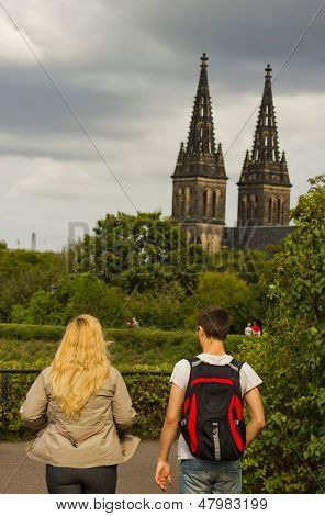 Young couple observing a panorama of a summer Prague city Czech Republic