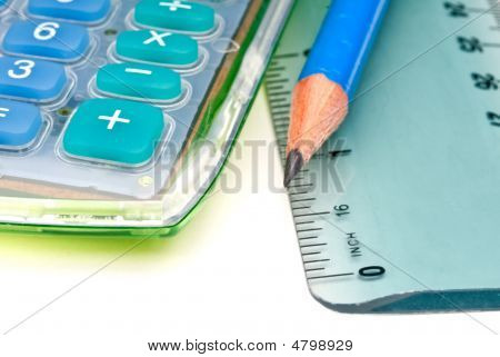 Blue Pencil With A Calulator And Ruler