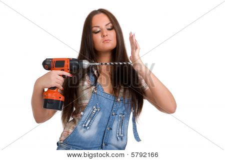 Young woman holding drill