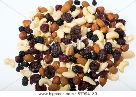 mixed nuts and dried fruits isolated on white background