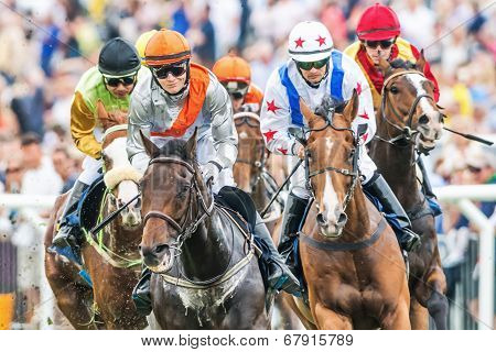 Closeup Of Jockeys Into Last Curve At The Nationaldags Galoppen