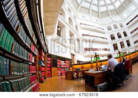 MELBOURNE - July 3, 2014: La Trobe reading room at the State Library of Victoria in Melbourne. The library holds over 2 million books.  It is the central library of the state of Victoria, Australia.