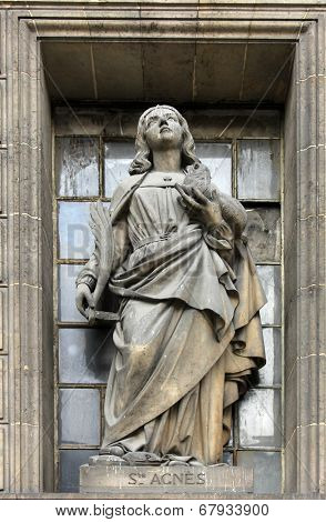 PARIS,FRANCE - NOV 09,2012: Saint Agnes of Rome, architectural details of Eglise de la Madeleine. Madeleine Church was designed in its present form as a temple to the glory of Napoleon's army.