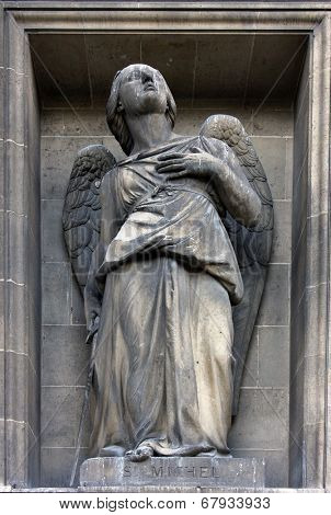 PARIS,FRANCE - NOV 09,2012: Archangel Michael, architectural details of Eglise de la Madeleine. Madeleine Church was designed in its present form as a temple to the glory of Napoleon's army.