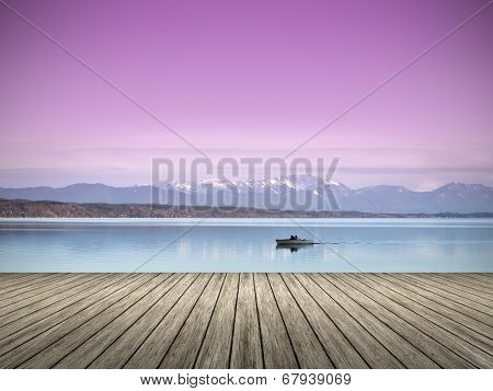 An image of a wooden jetty at the lake Starnberg in Bavaria Germany