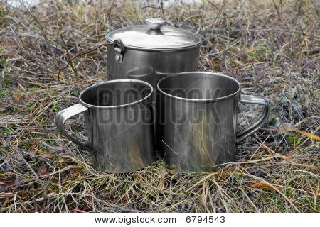 Tourists Cups On Dry Grass